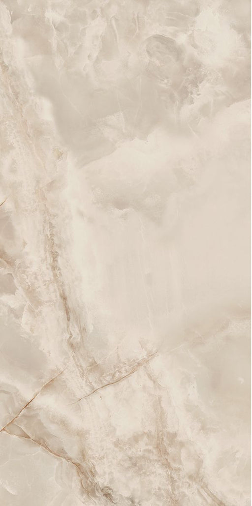 Close-up of Thebes Ivory Honed Matt Onyx 60x120cm porcelain tile featuring soft ivory onyx-effect veining with warm cream, beige and subtle golden tones. The honed matt finish creates a luxurious natural stone look, ideal for bathroom walls, feature walls and elegant interior spaces.