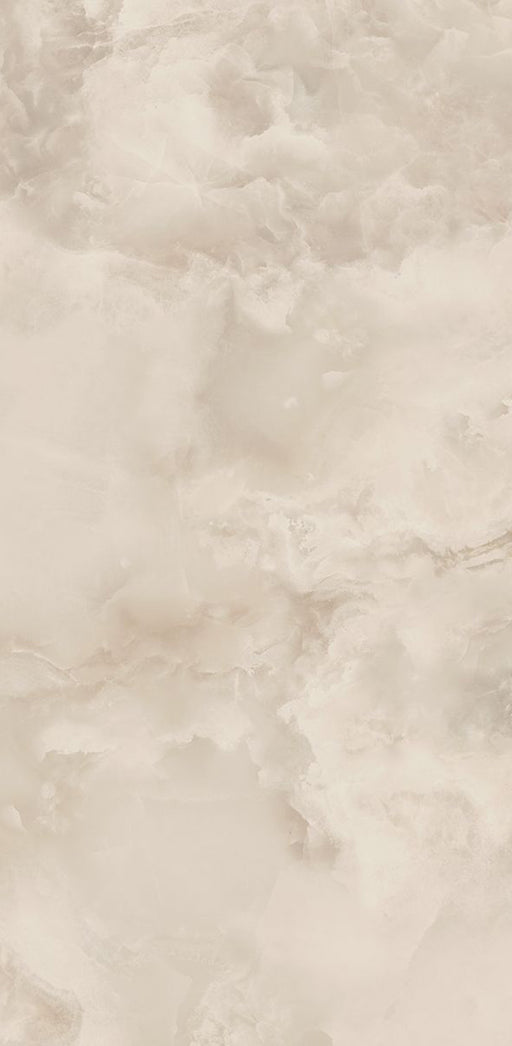Close-up of Thebes Ivory Honed Matt Onyx 60x120cm porcelain tile featuring soft ivory onyx-effect veining with warm cream, beige and subtle golden tones. The honed matt finish creates a luxurious natural stone look, ideal for bathroom walls, feature walls and elegant interior spaces.