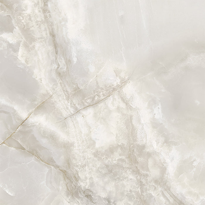 Close-up of Thebes White honed matt onyx effect porcelain tile in a 60cm x 60cm format, showcasing soft ivory and warm beige tones with delicate translucent veining and a realistic natural onyx effect finish.