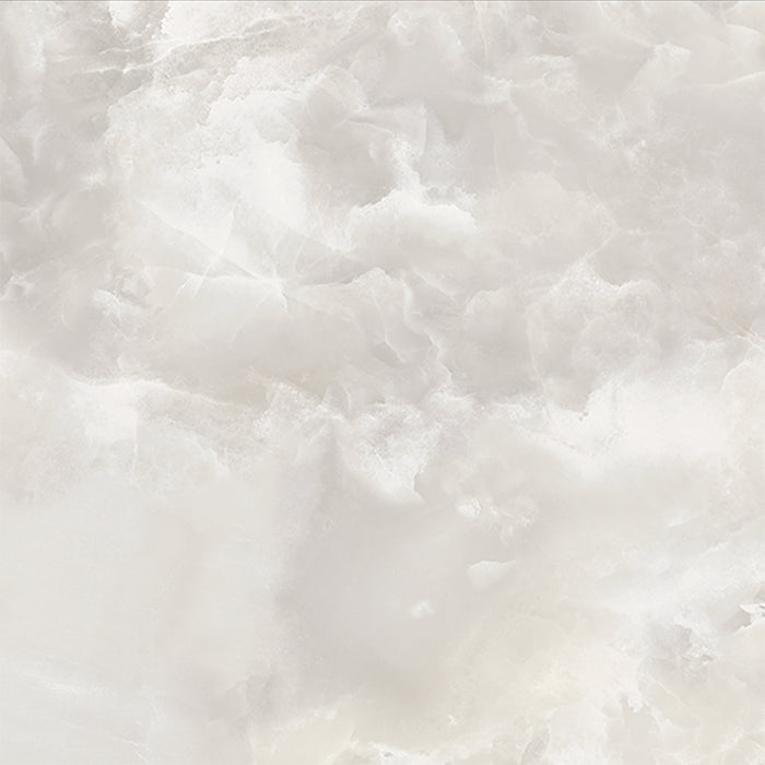 Close-up of Thebes White honed matt onyx effect porcelain tile in a 60cm x 60cm format, showcasing soft ivory and warm beige tones with delicate translucent veining and a realistic natural onyx effect finish.