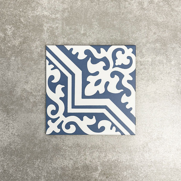 Single London Streets Thornton Place 20x20cm Victorian Moroccan style porcelain tile featuring an ornate corner pattern in soft blue and white tones, designed to create a repeating decorative floor layout inspired by traditional Victorian-style patterned tiles.