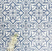 Overhead view of London Streets Thornton Place 20x20cm Victorian Moroccan style porcelain tiles arranged in a repeating blue and white patterned layout, styled with decorative foliage to highlight the intricate traditional Victorian-inspired floor design.