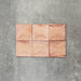 Close-up of Saigon Rose Pink Decor Square Wall tiles, featuring Moroccan-style 10 × 10cm glossy ceramic tiles in soft blush and rose tones with a curved decorative relief pattern.