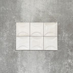 Saigon White Decor Square Wall tiles shown in a grouped layout, featuring Moroccan-style 10 × 10cm glossy ceramic tiles in soft white tones with a curved decorative relief pattern.