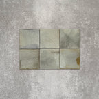 Close-up of Saigon Celadon Green Square Wall tiles in a Moroccan-inspired style, 10 × 10cm glossy ceramic tiles with soft green and blue-grey colour variation.