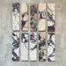 Fayrouz Viola 5x20cm natural marble tiles with a honed finish, featuring a white base with bold burgundy and warm-toned veining, arranged in a neat grid to highlight natural variation and distinctive stone detail.