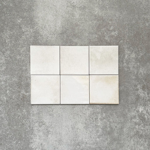 Close-up of Saigon White Square Wall tiles in a Moroccan-inspired style, 10 × 10cm glossy ceramic tiles in soft white tones with subtle tonal variation.