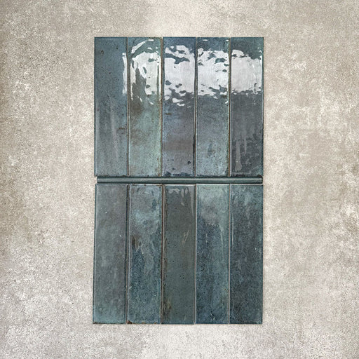 Allegra Blue Gloss pencil bullnose border ceramic tiles in a 1.2 × 30cm format, shown laid vertically to highlight the rich blue tones, glossy finish and subtle handmade-style variation, ideal for edging and decorative borders.