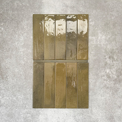 Allegra Daisy Green Gloss pencil bullnose border ceramic tiles in a 1.2 × 30cm format, shown laid vertically to highlight the rich green tones, glossy finish and subtle handmade-style variation, ideal for edging and decorative borders.