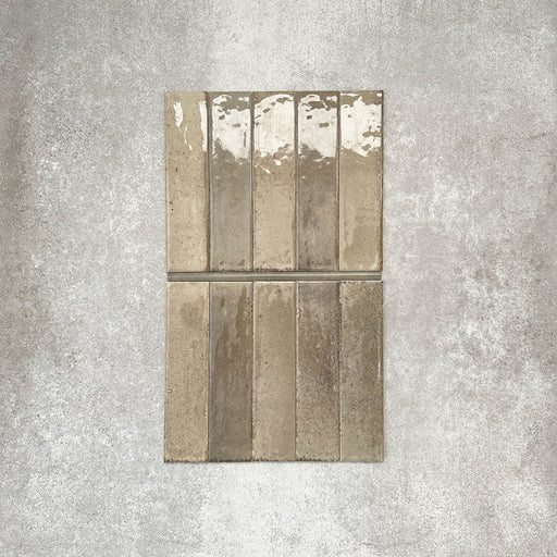 Allegra Sage Green Gloss pencil bullnose border ceramic tiles in a 1.2 × 30cm format, shown laid vertically to highlight the muted green tones, glossy finish and subtle handmade-style variation, ideal for edging and decorative borders.