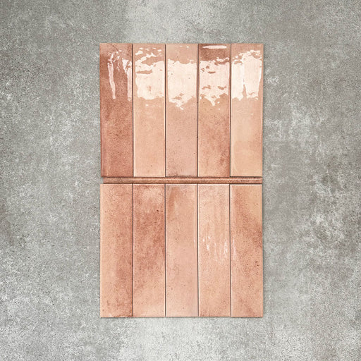 Allegra Tusk Pink Gloss pencil bullnose border ceramic tiles in a 1.2 × 30cm format, shown laid vertically to highlight the warm pink tones, glossy finish and subtle handmade-style variation, ideal for edging and decorative borders.