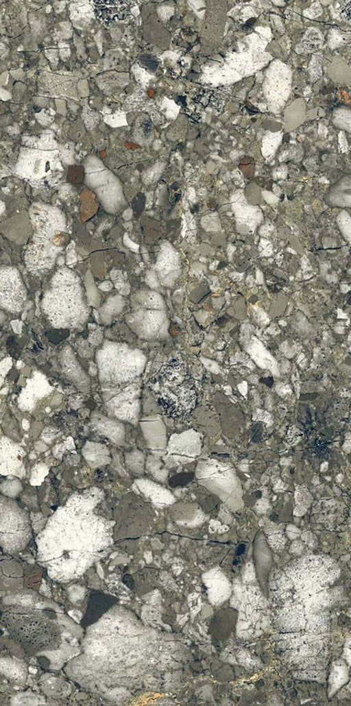 Close-up of Venice Emerald matt terrazzo effect porcelain tile, featuring a rich green-grey base with oversized marble chips and natural stone detailing, ideal for contemporary kitchen, bathroom and living room floors.