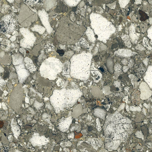Close-up of Venice Emerald matt terrazzo effect porcelain tile, featuring a rich green-grey base with oversized marble chips and natural stone detailing, ideal for contemporary kitchen, bathroom and living room floors.