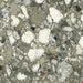 Close-up of Venice Emerald matt terrazzo effect porcelain tile, featuring a rich green-grey base with oversized marble chips and natural stone detailing, ideal for contemporary kitchen, bathroom and living room floors.