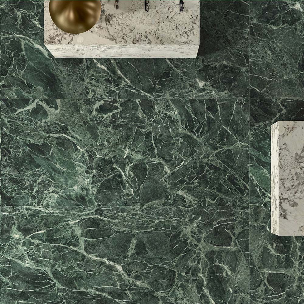 Bathroom interior featuring Verde Apia Polished Green Marble effect 60 × 60cm porcelain wall and floor tiles, styled with a floating vanity, brass basin, and rich green tones with intricate natural veining.