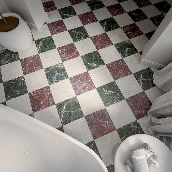 Bathroom floor featuring Divine Verde Green Matt Marble effect 30 × 30cm porcelain tiles in a chequerboard layout, combining green, red, and neutral tones, styled with soft furnishings and natural light.