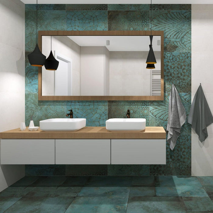Modern bathroom featuring Verde Patterns Copper Oxide 60cm x 60cm metallic effect porcelain wall and floor tiles, paired with a floating double vanity, timber-framed mirror, black pendant lights and contemporary styling.