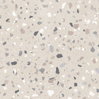 Close-up of Verona Medium Sand concrete effect porcelain tile featuring a warm sand-coloured terrazzo-inspired surface with medium-sized grey, taupe and white stone fragments, creating a timeless contemporary finish for walls and floors.