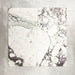 Close-up of Fayrouz Viola natural marble tiles in a honed finish, 30.5x61cm format, showcasing a soft white base with dramatic violet and deep grey veining, creating a bold yet refined look for wall and floor applications.