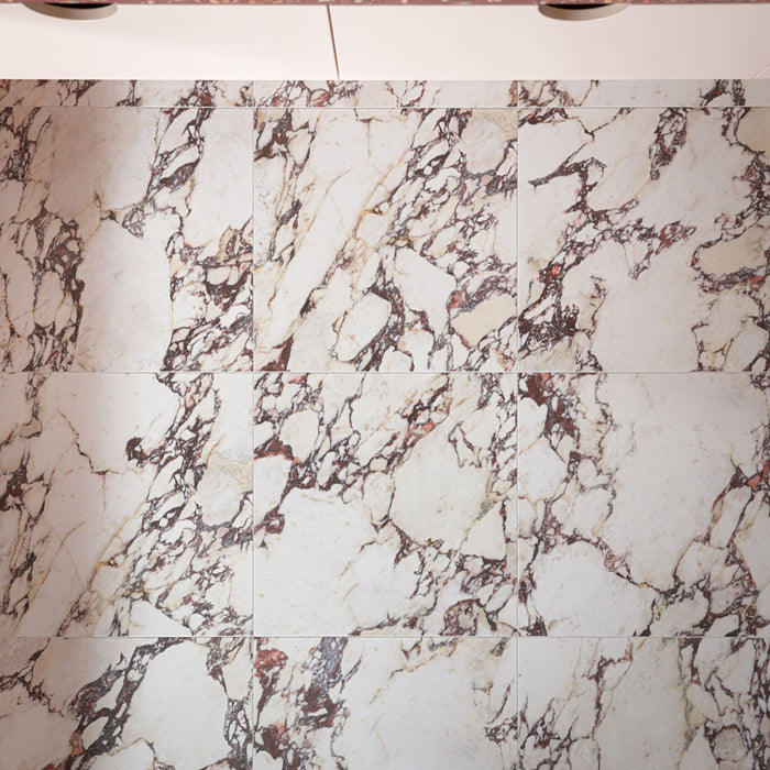 Viola Matt 60cm x 60cm marble effect porcelain floor tiles, featuring a warm white base with dramatic burgundy, grey and soft gold veining for a richly detailed finish.
