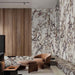 Living area featuring Viola Polished Marble effect 60 × 60cm porcelain wall and floor tiles, styled with warm wood panelling, leather seating, and soft furnishings, highlighting dramatic veining and a high-gloss finish.