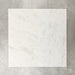 Close-up of Fayrouz White natural marble tiles in a honed finish, 30.5x61cm format, showcasing a soft white base with subtle grey veining and gentle tonal variation, creating a refined and timeless look for wall and floor applications.