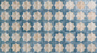 Close-up of Zanzibar Moroccan Arena Blue wall tile featuring a repeating blue and cream Moroccan style eight-point star pattern with a softly weathered finish, perfect for decorative kitchen and bathroom feature walls.