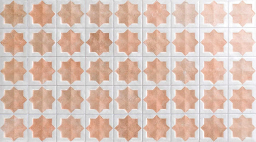 Close-up of Zanzibar Moroccan Cotto White ceramic wall tiles featuring a repeating Moroccan style star pattern in warm terracotta and soft white with a glossy finish, ideal for kitchen splashbacks, bathroom walls and decorative feature walls.