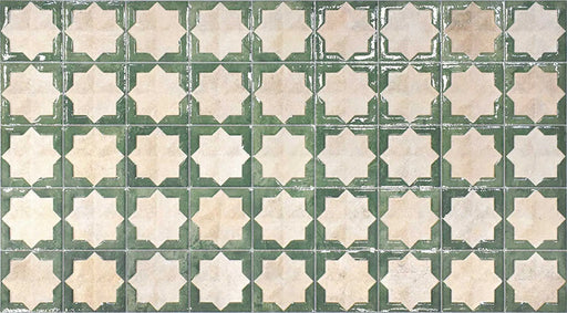 Close-up of Zanzibar Moroccan Emerald Green ceramic wall tiles featuring a repeating Moroccan style geometric star pattern in soft emerald green and warm ivory tones, with a glossy glazed finish and subtle distressed detailing for an authentic handcrafted look.