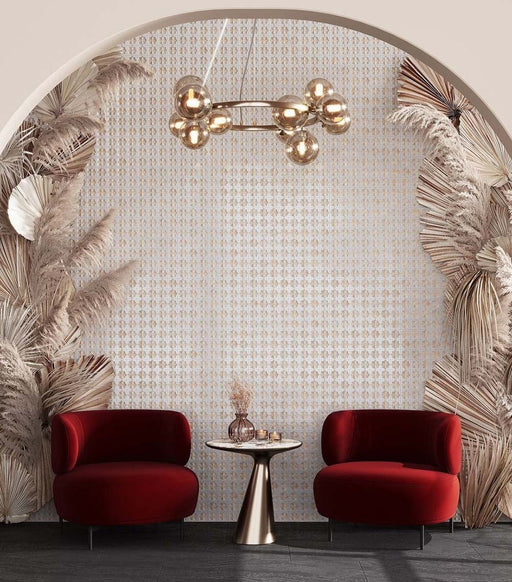 Feature wall featuring Zanzibar Moroccan Natural White ceramic wall tiles in a repeating Moroccan style geometric pattern, framed by an elegant arched alcove with decorative dried palm leaves, plush burgundy lounge chairs, brass lighting and dark floor tiles for a luxurious boutique-inspired interior.