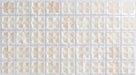 Close-up of Zanzibar Moroccan Natural White ceramic wall tiles featuring a repeating Moroccan style geometric star pattern in soft white and warm natural tones, with a glossy glazed finish, subtle shade variation and handcrafted-inspired detailing.