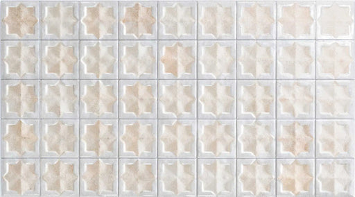 Close-up of Zanzibar Moroccan Natural White ceramic wall tiles featuring a repeating Moroccan style geometric star pattern in soft white and warm natural tones, with a glossy glazed finish, subtle shade variation and handcrafted-inspired detailing.
