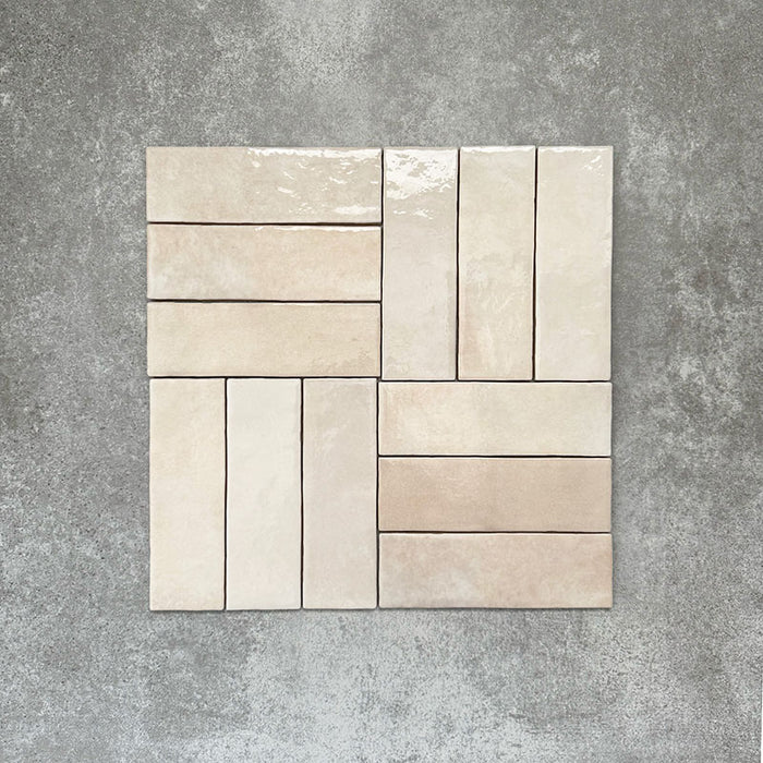 Zellige Bone Moroccan-style brick tiles in a warm beige tone, shown in a simple basketweave layout.