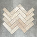 Zellige Bone Moroccan-style brick tiles in a warm beige tone, shown in a simple herringbone layout.