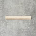 Zellige Bone Moroccan-style bullnose ceramic tile in a warm beige tone, shown in a neat flat lay arrangement.