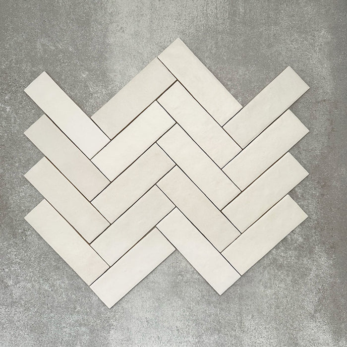 Herringbone layout featuring Zellige Chalk White Moroccan-style brick tiles in a 6.5 × 20cm format.