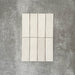 Zellige Chalk White Moroccan-style brick tiles in a 6.5 × 20cm format, showing a soft chalky white glaze with subtle handmade surface variation.