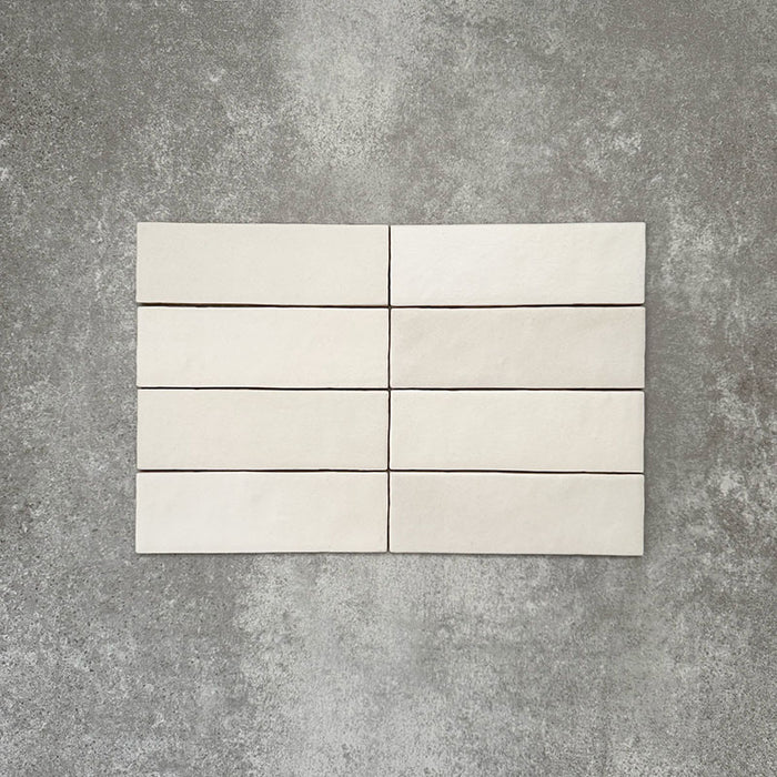 Zellige Chalk White Moroccan-style brick tiles in a 6.5 × 20cm format, showing a soft chalky white glaze with subtle handmade surface variation.