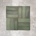 Flat lay of Zellige Malachite Green 6.5×20cm Moroccan-style ceramic brick tiles, arranged in a basketweave layout, showcasing subtle tonal variation, handmade-look texture and rich green glaze on a neutral background.