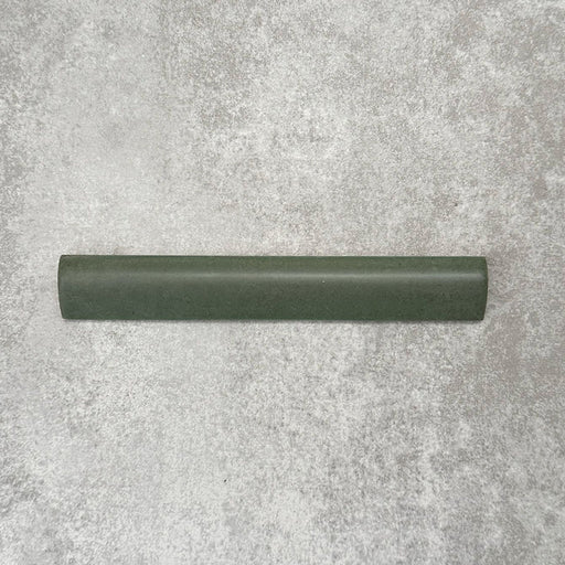 Zellige Malachite Green 3×20cm Moroccan-style ceramic bullnose tile, showcasing the rounded edge profile, rich green glaze and subtle tonal variation on a neutral background.