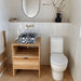 Bathroom featuring Zellige Oyster Brick Moroccan-style ceramic wall tiles in a 6.5 × 20cm brick format, installed vertically to create textured half-height walls, paired with a terrazzo countertop basin, warm wood vanity and brass fixtures for a soft, contemporary bathroom design.