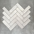 Herringbone layout showcasing Zellige Oyster Brick Moroccan-style ceramic tiles in a 6.5 × 20cm format, with the angled pattern emphasising the handcrafted edges, glossy oyster glaze and natural tonal variation for a timeless, artisanal finish.