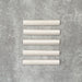 Zellige Oyster bullnose ceramic tiles in a soft oyster white finish, 3 × 20 cm, shown laid flat on a neutral background.