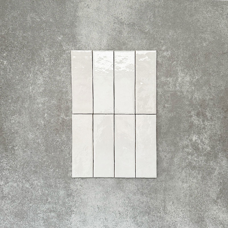 Zellige White brick tiles in a 6.5 × 20cm format, shown in a clean white gloss with subtle surface variation.