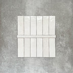 Zellige White Moroccan-style ceramic brick tiles with matching 3 × 20cm bullnose trim, shown in a clean, glossy white finish.