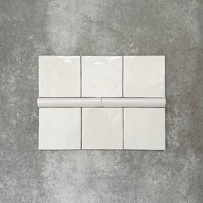 Zellige White Moroccan-style ceramic square tiles with matching 3 × 20cm bullnose trim, shown in a clean, glossy white finish.
