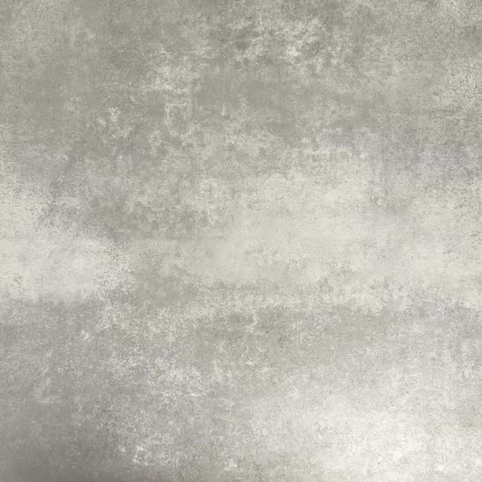 Video showcasing four Fayrouz Black 15.2x15.2cm natural marble tiles with a honed finish arranged together, showcasing deep black tones, bold white veining and natural variation against a neutral textured background.
