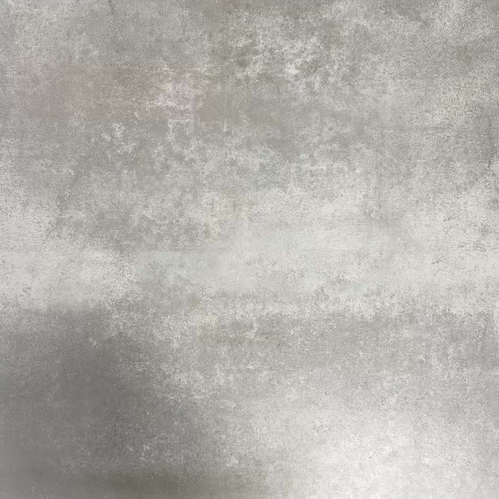 Video showcasing Fez Artisan 20x20cm Moroccan-style porcelain tiles arranged as a four-tile panel, highlighting the full repeat design with soft blue, blush pink, green and terracotta geometric star motifs against a textured grey background.