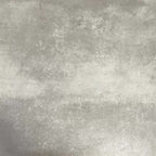 Video showcasing Fez Mini Summer 15x15cm Moroccan-style porcelain tile displayed against a textured grey background, highlighting the colourful geometric star pattern in soft green, blue and blush pink tones with an encaustic-inspired finish.