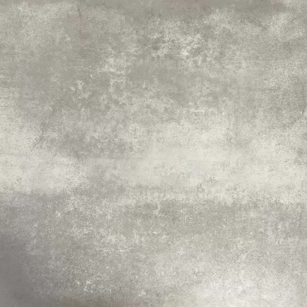 Video showcasing Fez Mini Summer 15x15cm Moroccan-style porcelain tile displayed against a textured grey background, highlighting the colourful geometric star pattern in soft green, blue and blush pink tones with an encaustic-inspired finish.